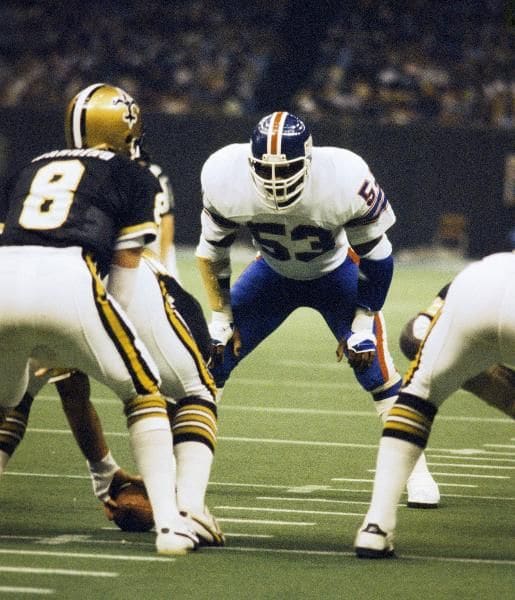 New York Giants LB Harry Carson (53) eyes up New Orleans Saints QB Archie Manning (8) during a 1978 game. Credit: nfl.com